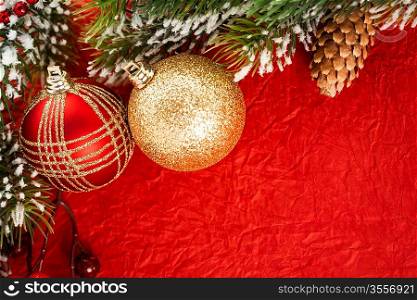 High angle shot of Christmas balls on red paper. Shallow depth of fields