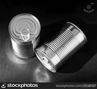 high angle silver tall round tin cans