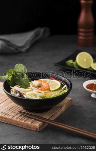 high angle soup with noodles chopsticks