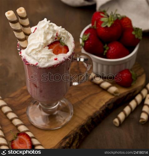 high angle strawberry milkshake with cream