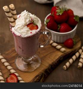 high angle strawberry milkshake with cream