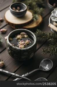 high angle tea with dried flowers rustic mug