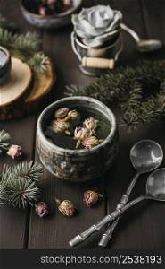 high angle tea with dried flowers rustic mug with teaspoons