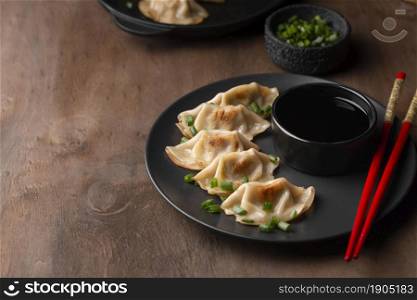 high angle traditional asian dish with chopsticks herbs. Beautiful photo. high angle traditional asian dish with chopsticks herbs