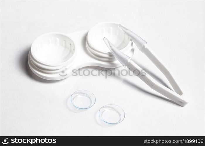 high angle transparent contact lenses with case tweezers. Resolution and high quality beautiful photo. high angle transparent contact lenses with case tweezers. High quality beautiful photo concept