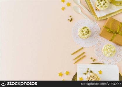 high angle view birthday gifts muffins colored background