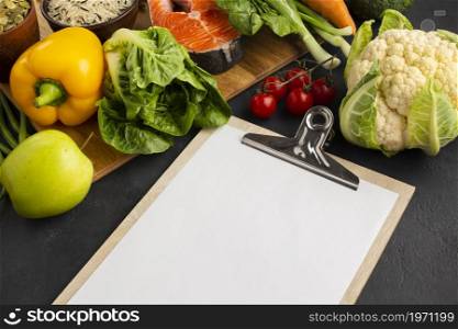 high angle view clipboard with vegetables. High resolution photo. high angle view clipboard with vegetables. High quality photo