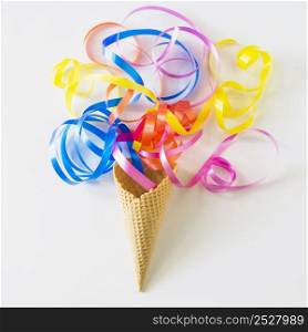 high angle view colorful ribbons waffle ice cream cone white surface