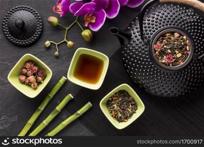 high angle view dried herb ingredient bamboo stick with orchid flower