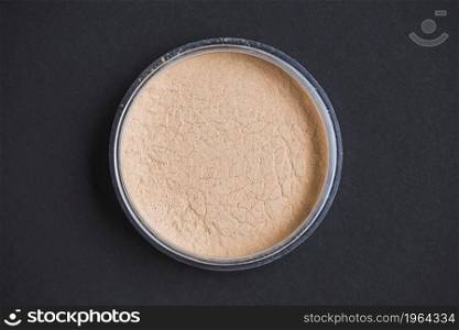 high angle view face powder black background. High resolution photo. high angle view face powder black background. High quality photo