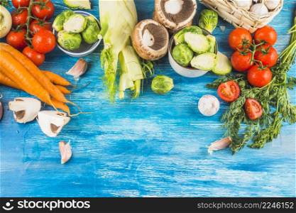 high angle view fresh organic vegetables blue wooden backdrop