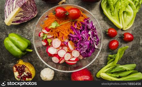 high angle view fresh salad glass bowl surrounded with vegetables fruits
