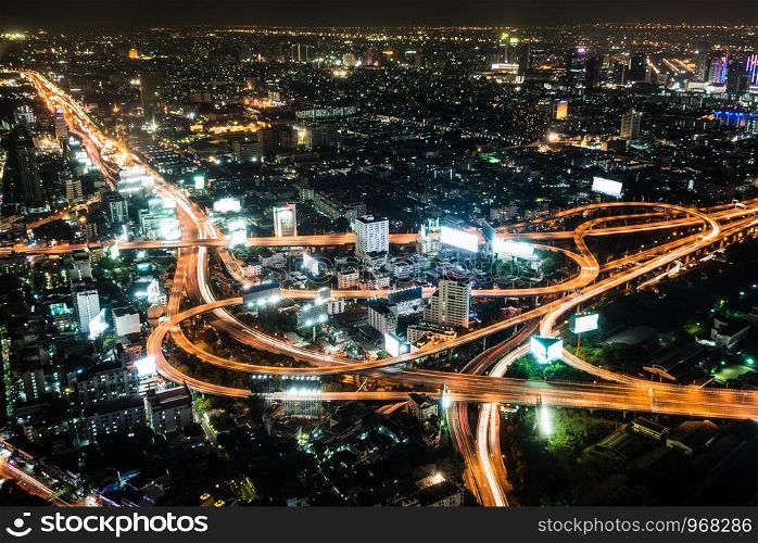 High angle view landscape night scene of cityscape see the bright light bulb of the highway, skyscraper, road, and horizon, Residential building of Bangkok the capital city of Thailand in Asia. High view night scene of Bangkok, Thailand