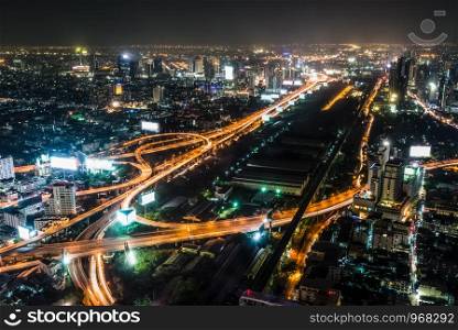 High angle view landscape night scene of cityscape see the bright light bulb of the highway, skyscraper, road, and horizon, Residential building of Bangkok the capital city of Thailand in Asia. High view night scene of Bangkok, Thailand
