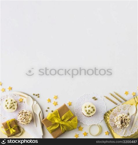 high angle view muffins gifts edge white backdrop