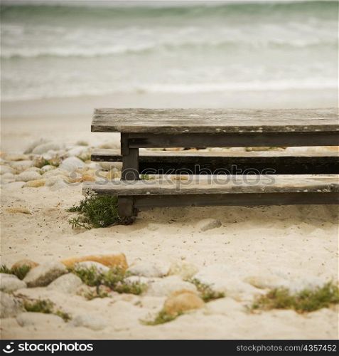High angle view of a bench on the beach