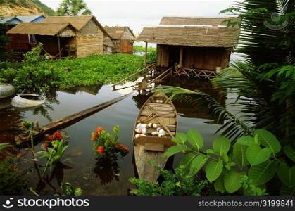 High angle view of a boat in front of a house in a flooded village, Siem Reap, Cambodia
