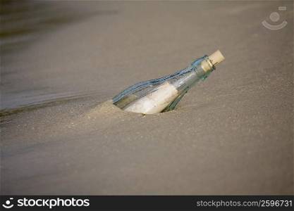 High angle view of a bottle on the beach