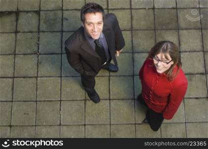 High angle view of a businessman standing with a businesswoman