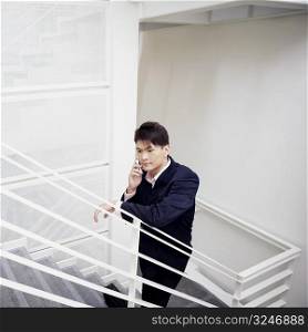 High angle view of a businessman talking on a mobile phone