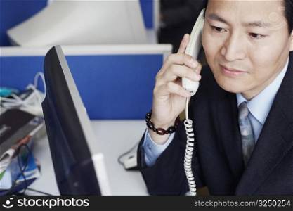 High angle view of a businessman talking on the telephone