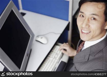 High angle view of a businessman using a computer