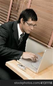 High angle view of a businessman using a laptop