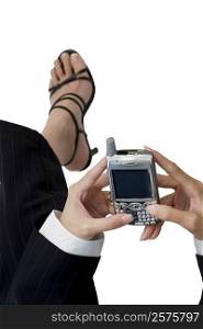 High angle view of a businesswoman holding a mobile phone