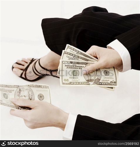 High angle view of a businesswoman holding dollar bills