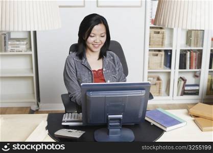 High angle view of a businesswoman sitting in front of a computer