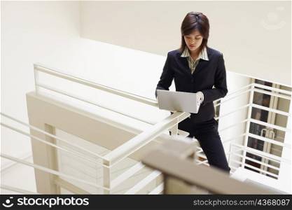 High angle view of a businesswoman using a laptop