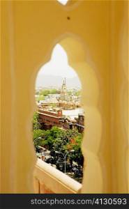 High angle view of a city seen through a window, City Palace, Jaipur, Rajasthan, India