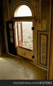 High angle view of a city seen through an arched window of a fort, Nahargarh Fort, Jaipur, Rajasthan, India