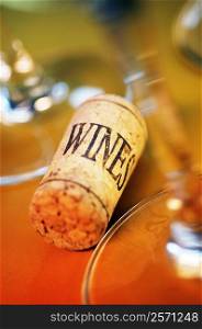 High angle view of a cork with wine glasses