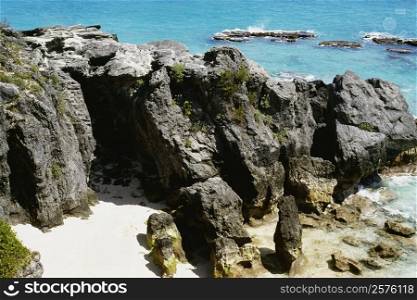 High angle view of a couple amid the rocks, Atwood bay beach, Bermuda