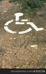 High angle view of a disabled sign on the road