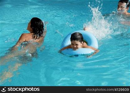 High angle view of a family in a swimming pool
