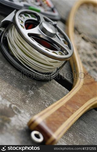 High angle view of a fishing reel and a fishing net