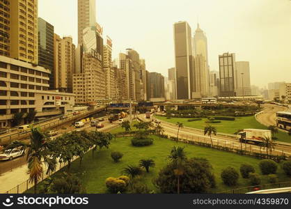 High angle view of a garden in front of skyscrapers, Hong Kong, China
