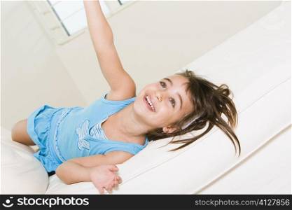 High angle view of a girl lying on the bed