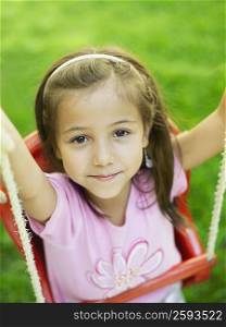 High angle view of a girl on a swing