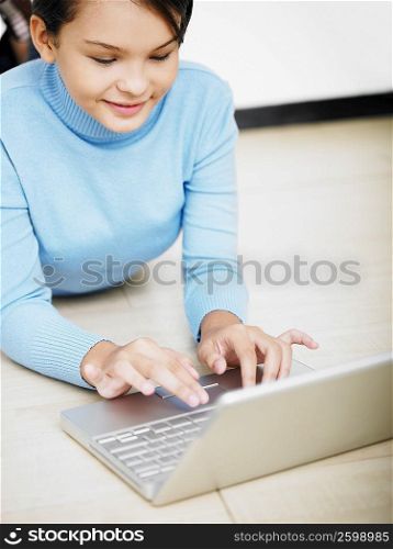 High angle view of a girl using a laptop