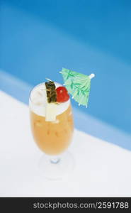 High angle view of a glass of cocktail at the poolside