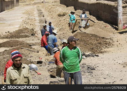 High angle view of a group of people digging a road, Puno, Cuzco, Peru