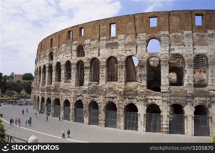 High angle view of a group of people in front of an amphitheater, Coliseum, Rome, Italy