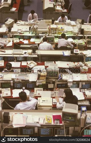 High angle view of a group of people working in a financial company, Tokyo Prefecture, Japan