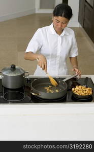 High angle view of a maid preparing food in the kitchen