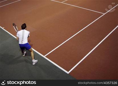 High angle view of a man playing tennis