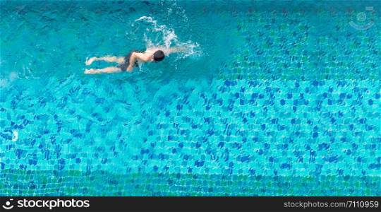 High angle view of a man swimming in a swimming pool