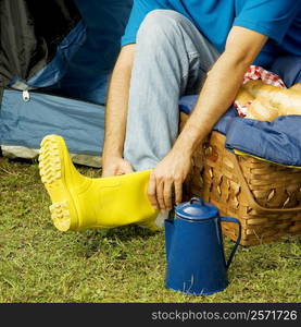 High angle view of a man wearing galoshes